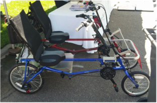 Veteran's Special: Red and Blue EZ Classic Sun Bike Recumbents attached together to make a 4 wheeled bicycle.