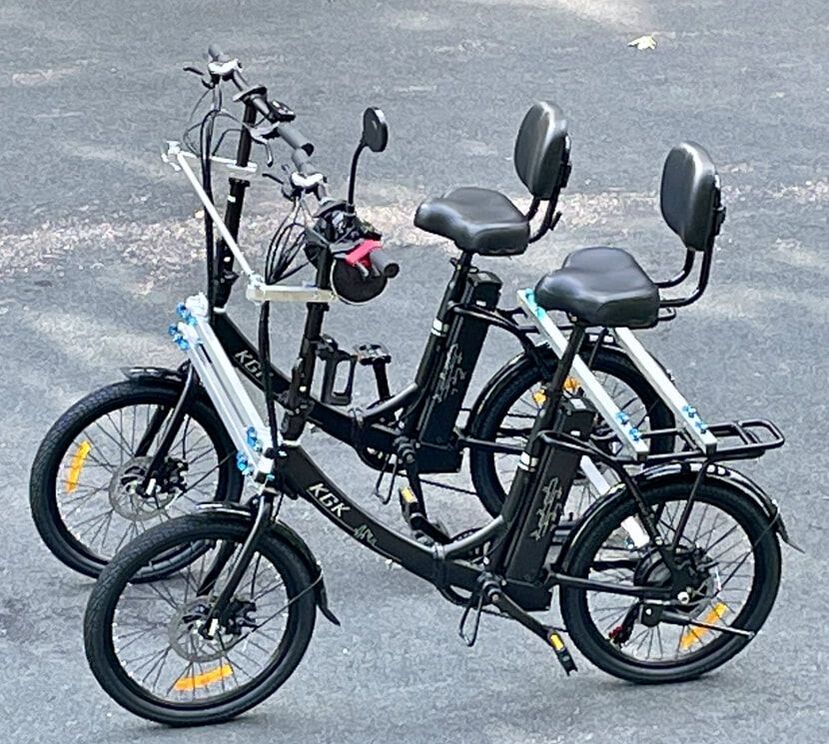 Two low step-through eBikes combine to make a quad bike, or 4 wheeled pedal vehicle, for sociable bike riding.