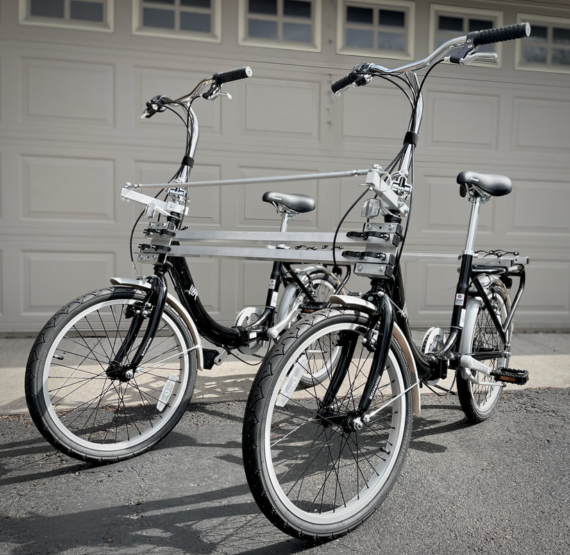 Schwinn Loop folding bikes combined with a non-intrusive bicycle connection kit for adaptive bike riding.